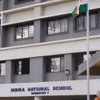 Indira National School logo